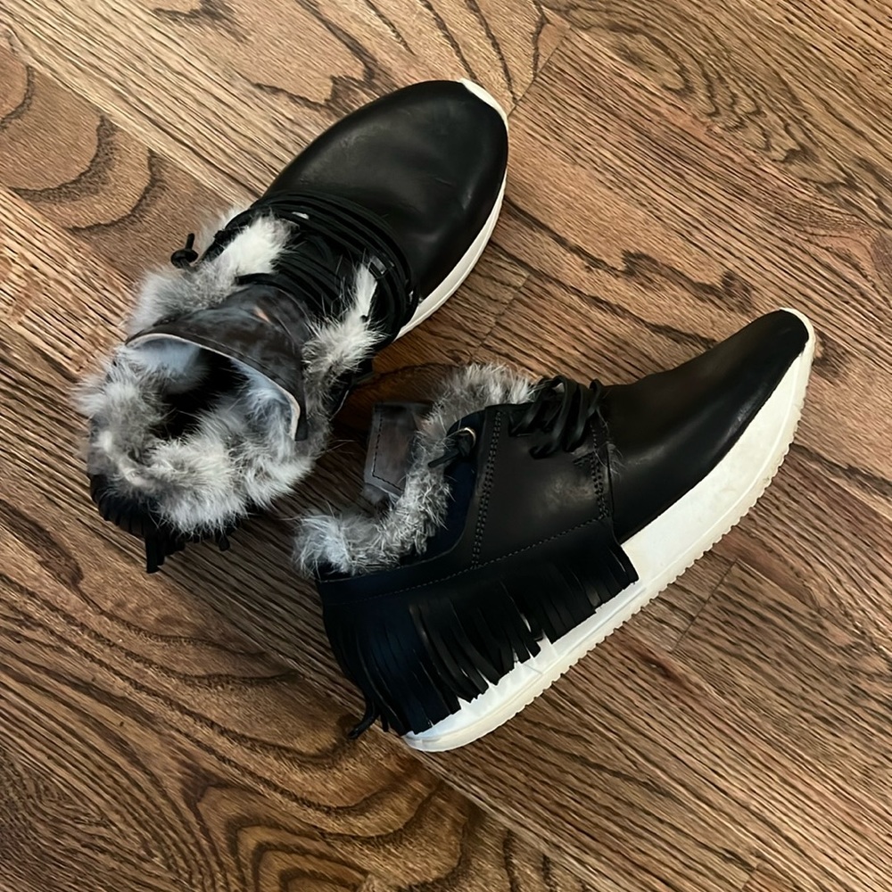 Esseutesse’s Leather and Fur Fringe Sneakers